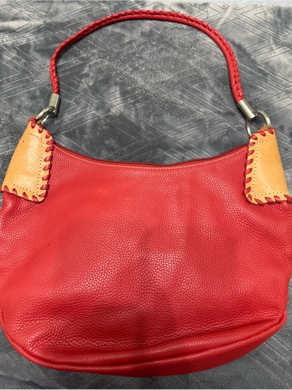 Beautiful red leather OMBU shoulder bag with contrast stitching and tan accents